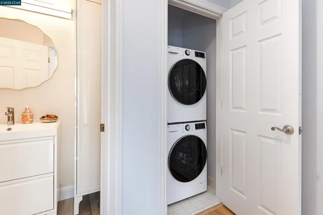 a view of a hallway with washer and dryer