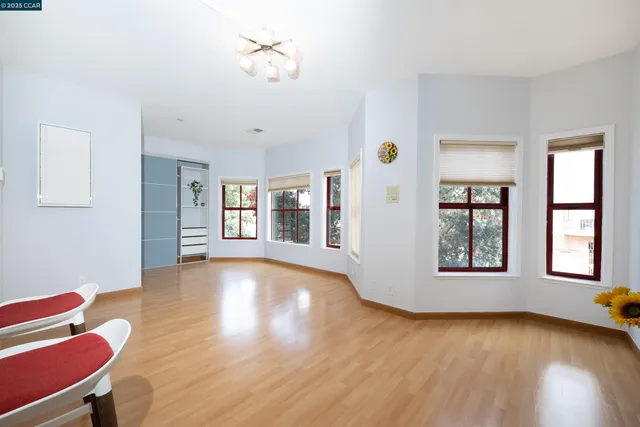 a view of an room with wooden floor and windows