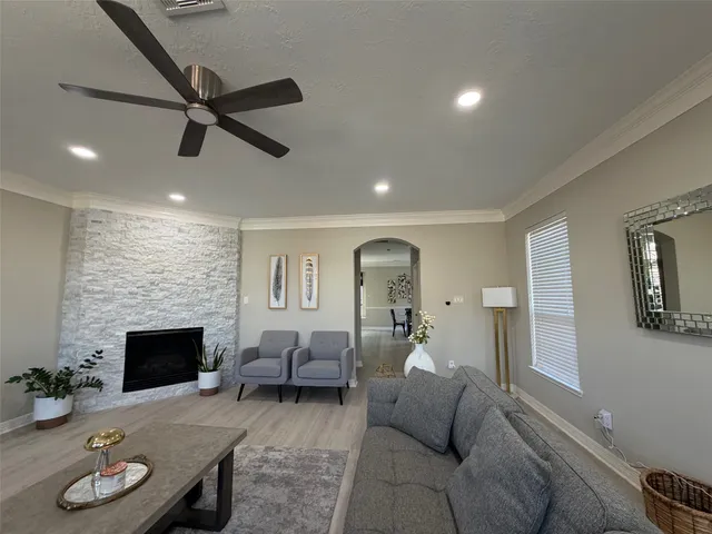 a living room with furniture and a fireplace