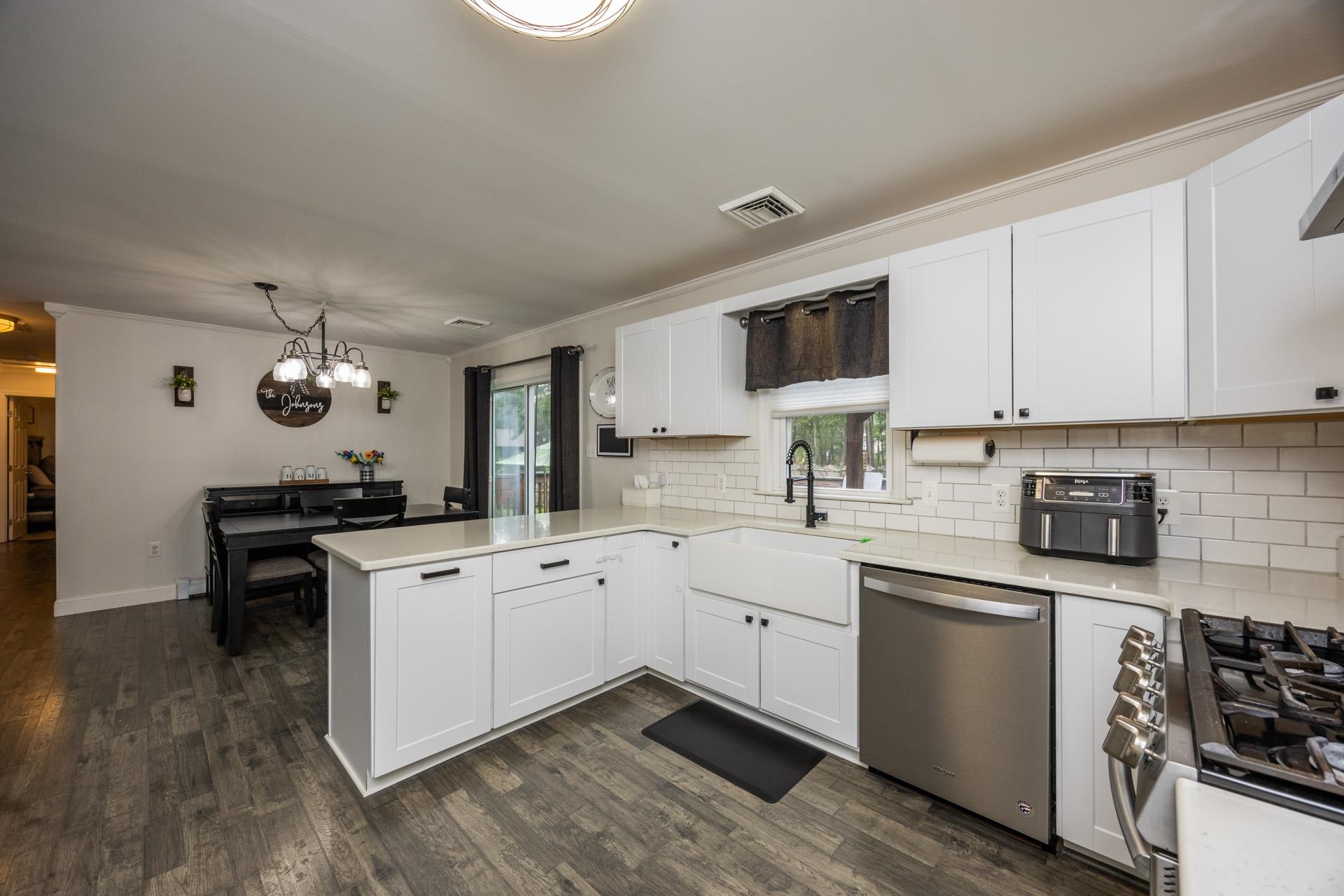 405 Old Goshen Road Ocean View, NJ 08230 - Photo 12 of 38 a kitchen with a sink stove and cabinets