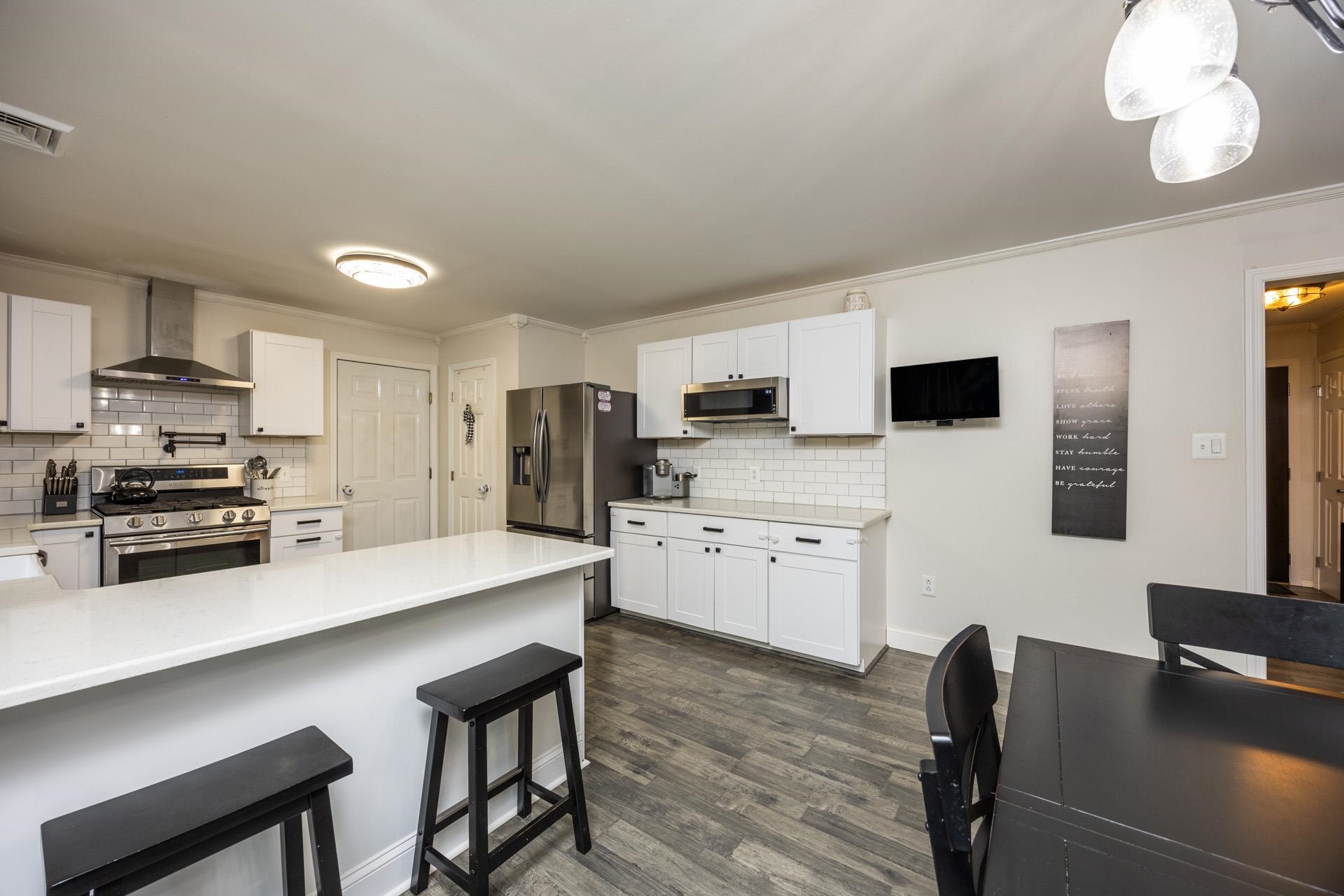 405 Old Goshen Road Ocean View, NJ 08230 - Photo 14 of 38 a kitchen with stainless steel appliances a stove a sink a microwave and a refrigerator