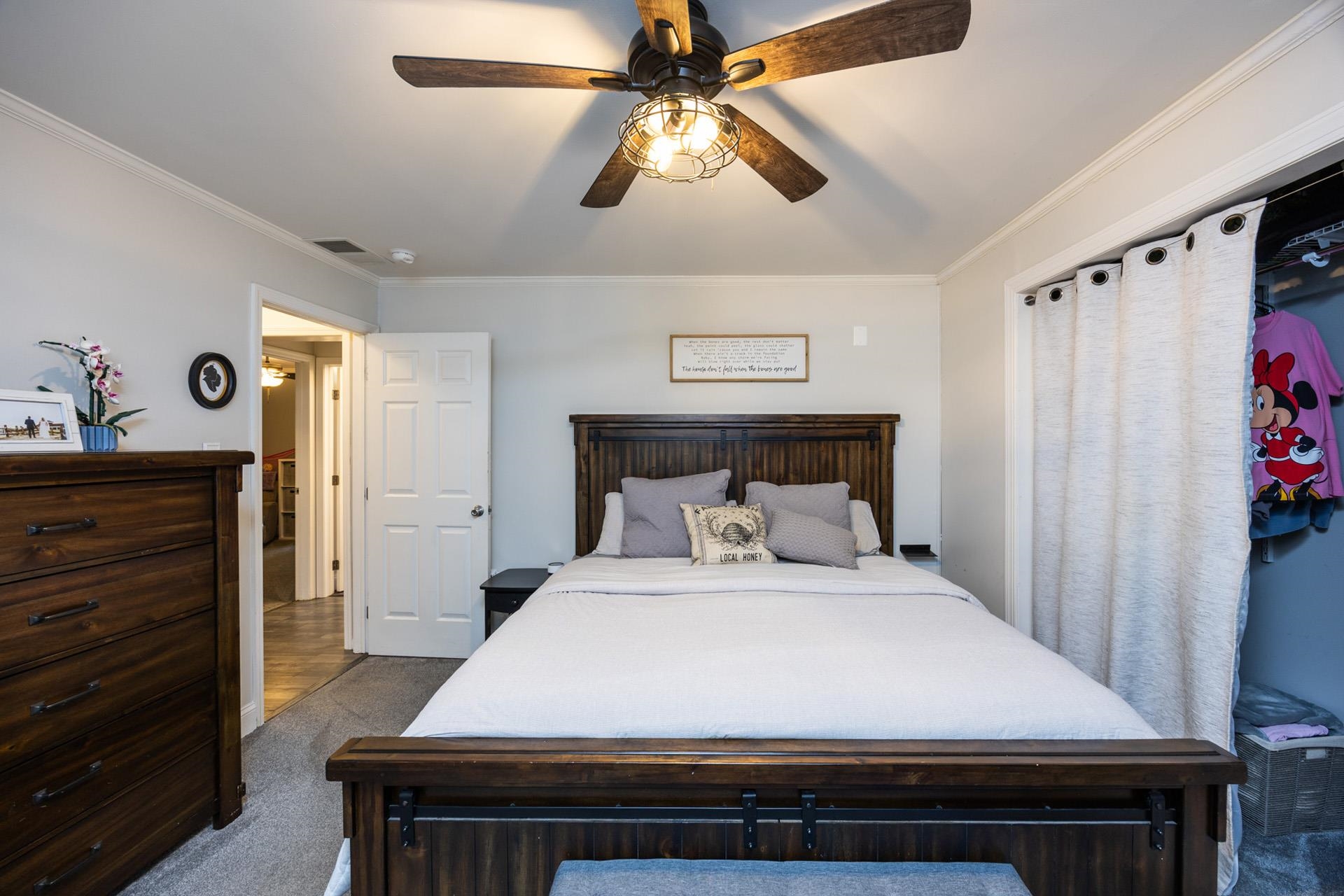 405 Old Goshen Road Ocean View, NJ 08230 - Photo 28 of 38 a bedroom with a bed and a chandelier