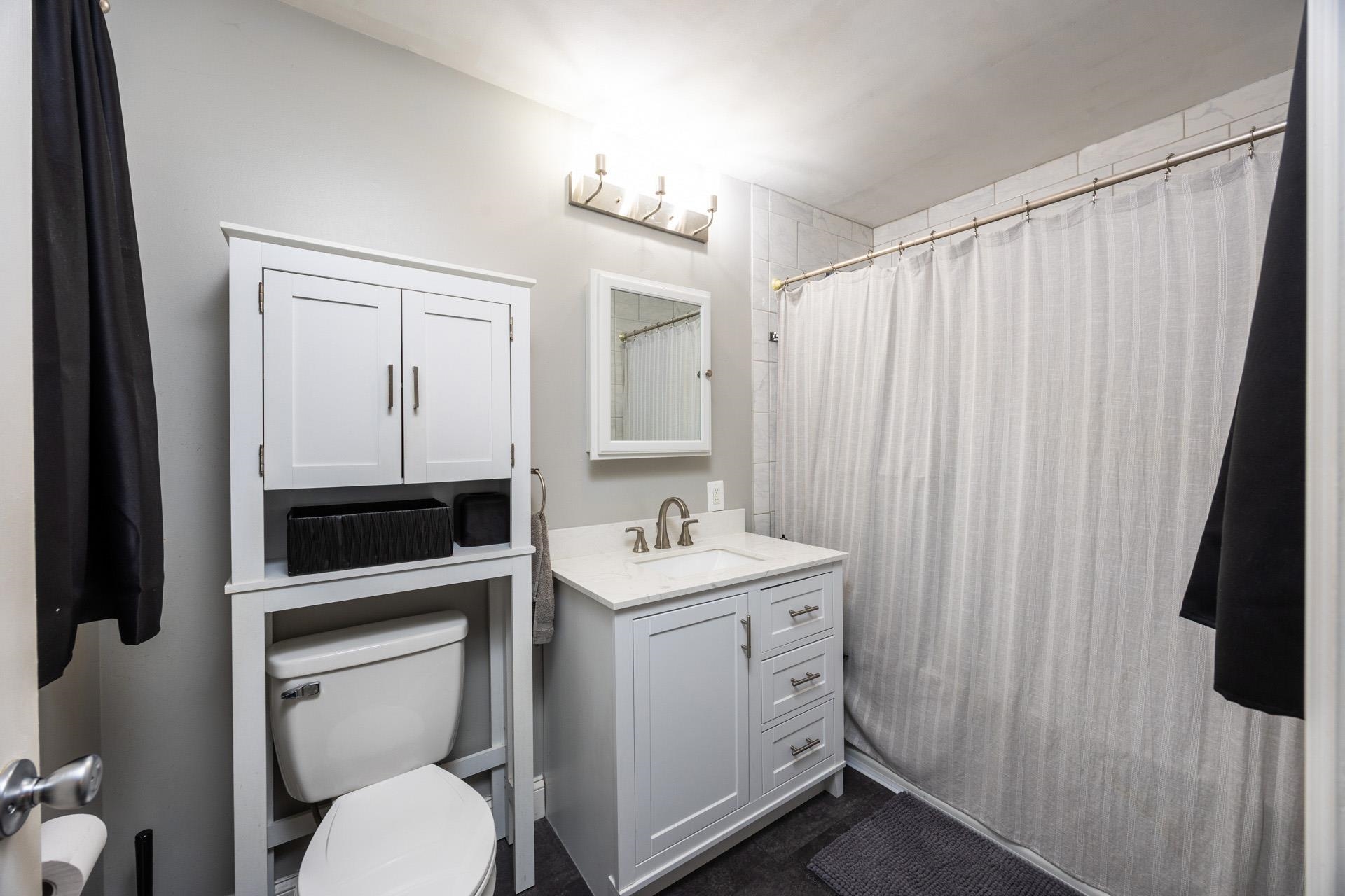 405 Old Goshen Road Ocean View, NJ 08230 - Photo 30 of 38 a bathroom with a sink toilet and shower