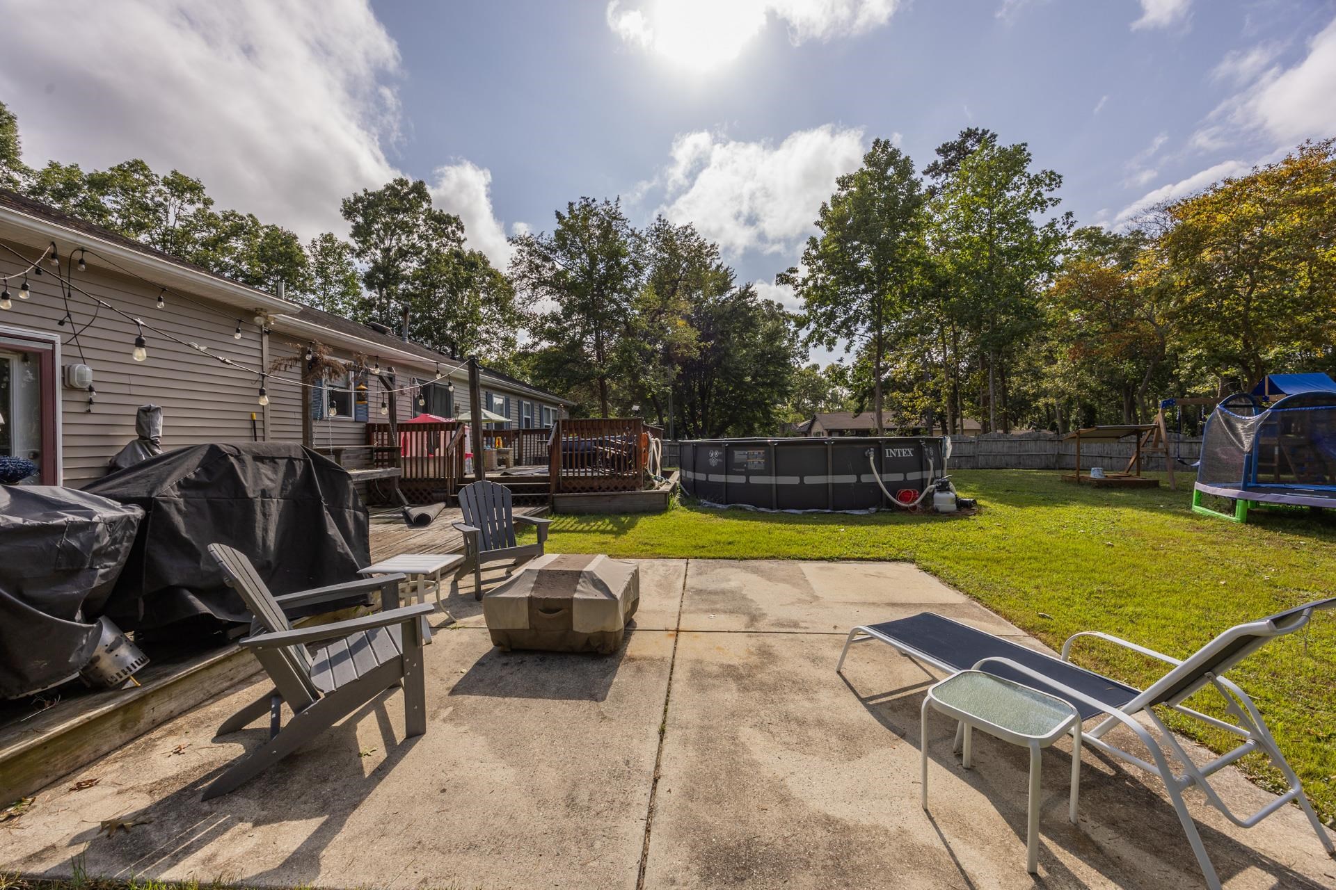 405 Old Goshen Road Ocean View, NJ 08230 - Photo 34 of 38 a view of a backyard with swimming pool and furniture