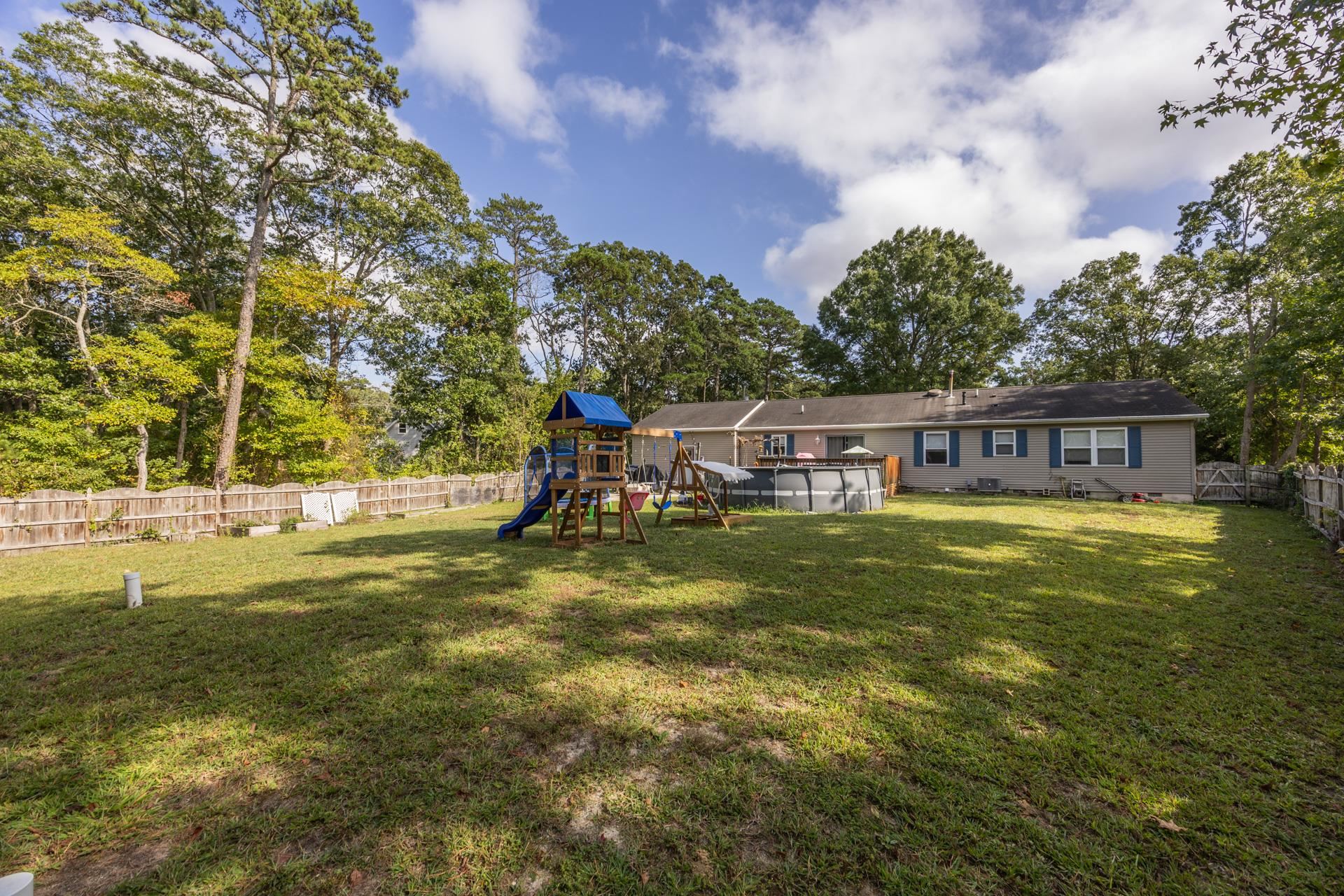 405 Old Goshen Road Ocean View, NJ 08230 - Photo 36 of 38 a view of a swimming pool with a table and chairs