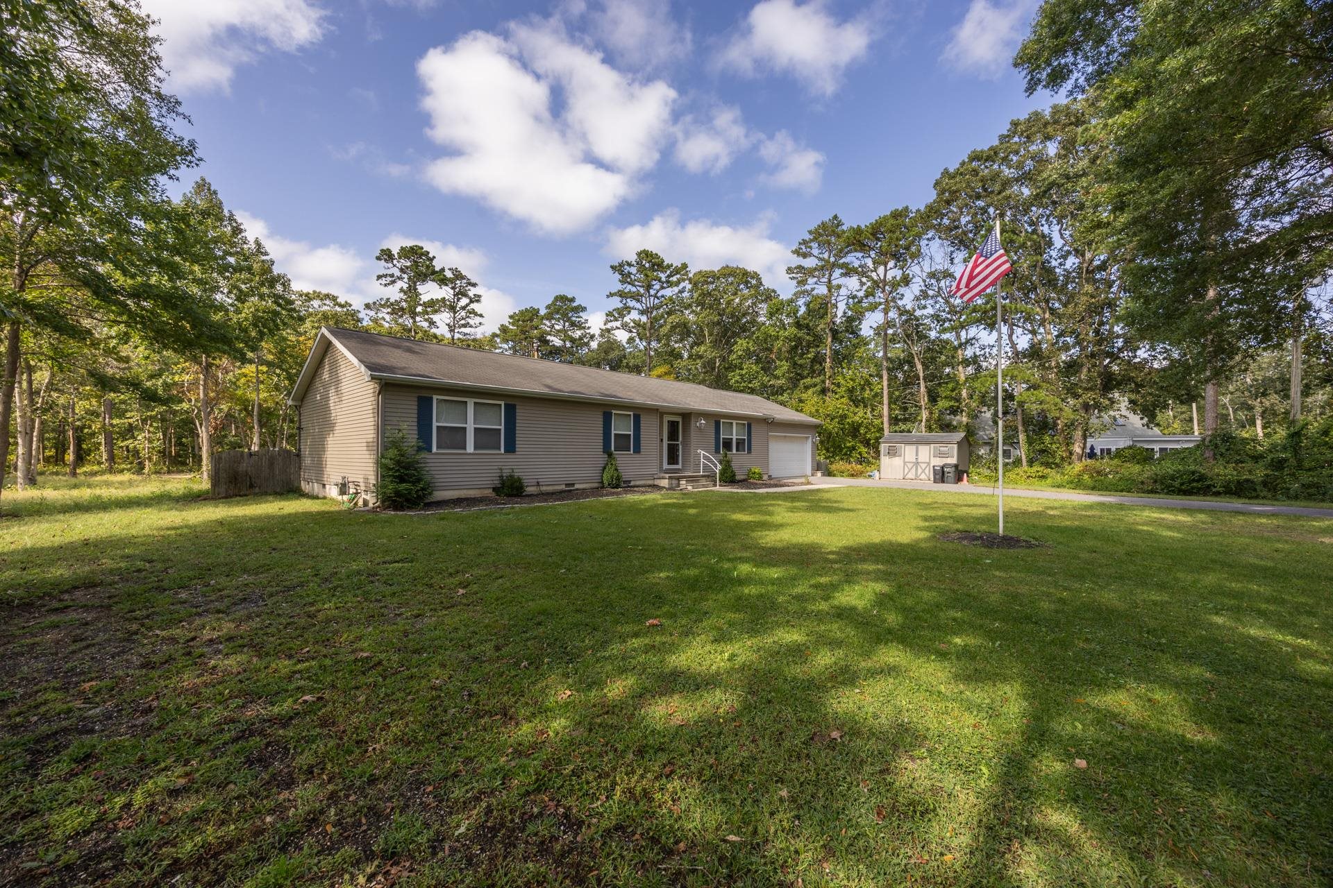 405 Old Goshen Road Ocean View, NJ 08230 - Photo 4 of 38 a front view of house with yard and green space