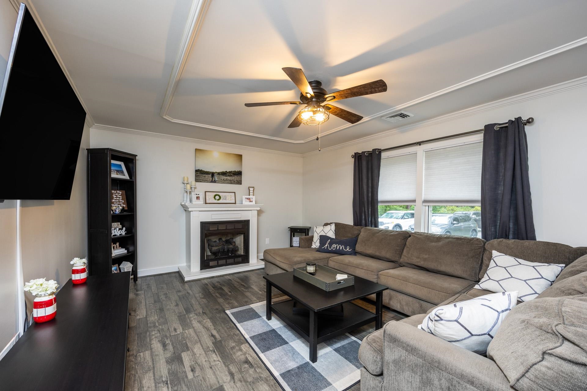 405 Old Goshen Road Ocean View, NJ 08230 - Photo 5 of 38 a living room with furniture a fireplace and a flat screen tv