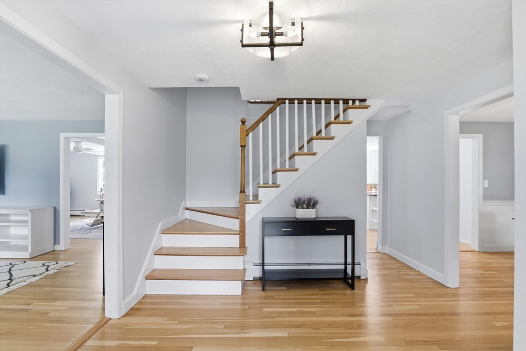 94 Johnson Road Winchester, MA 01890 - Photo 16 of 40 a view of entryway and hall with wooden floor