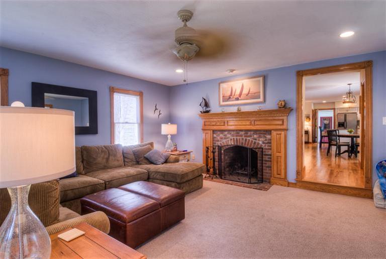 200 Evergreen Drive Marstons Mills, MA 02648 - Photo 13 of 25 a living room with furniture and a fireplace