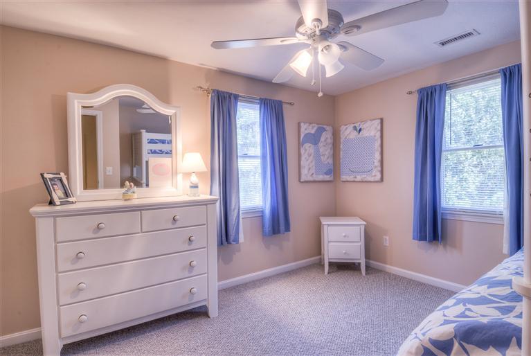 200 Evergreen Drive Marstons Mills, MA 02648 - Photo 15 of 25 a bedroom with a bed and a dresser