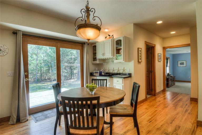 200 Evergreen Drive Marstons Mills, MA 02648 - Photo 10 of 25 a view of a dining room with furniture window and wooden floor