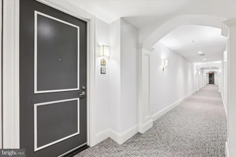 a view of an empty room and bathroom