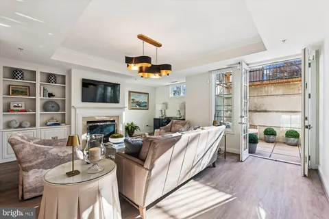 a living room with furniture fireplace and a flat screen tv