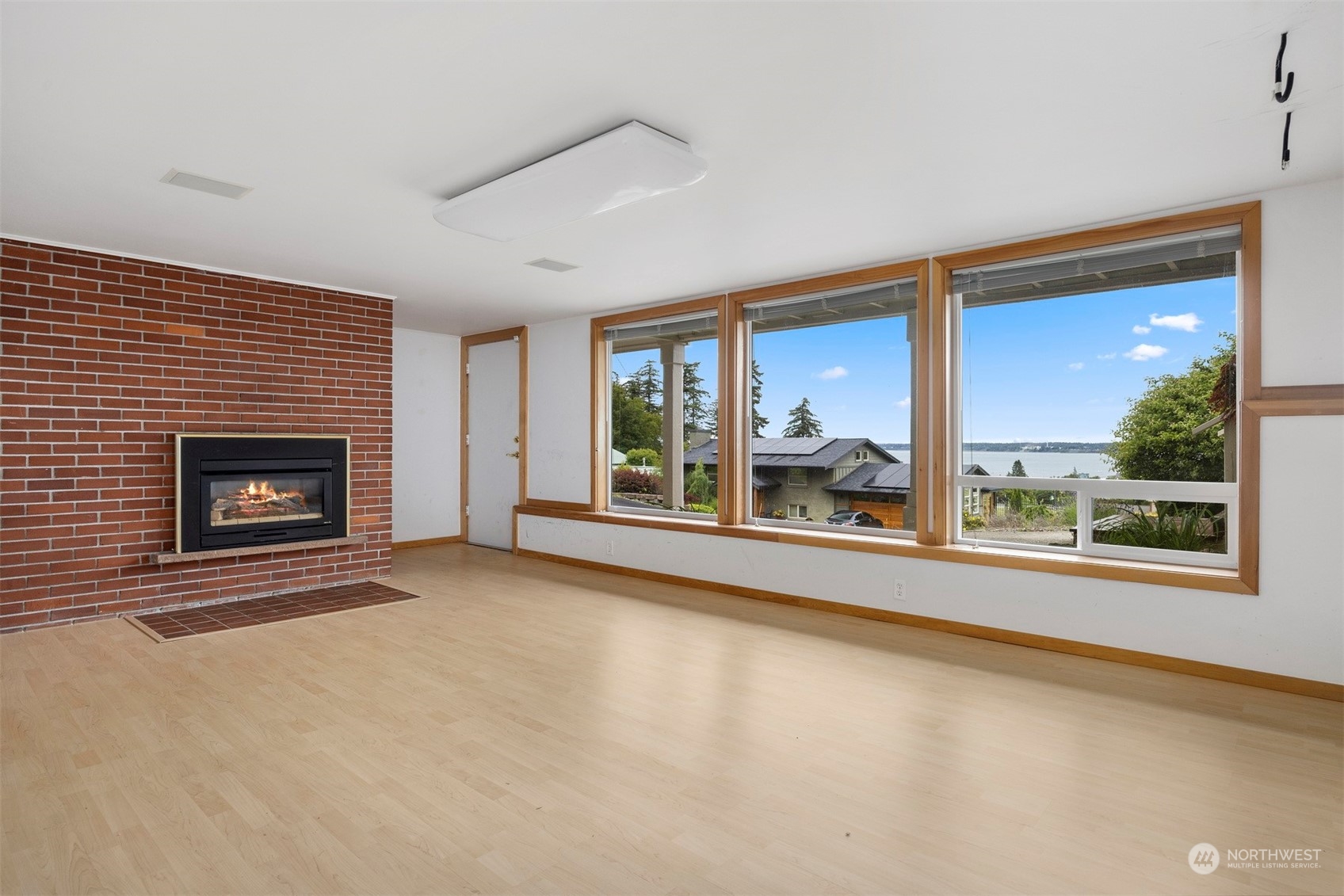 117 Underhill Road Bellingham, WA 98225 - Photo 28 of 40 a view of an empty room with a fireplace and a window