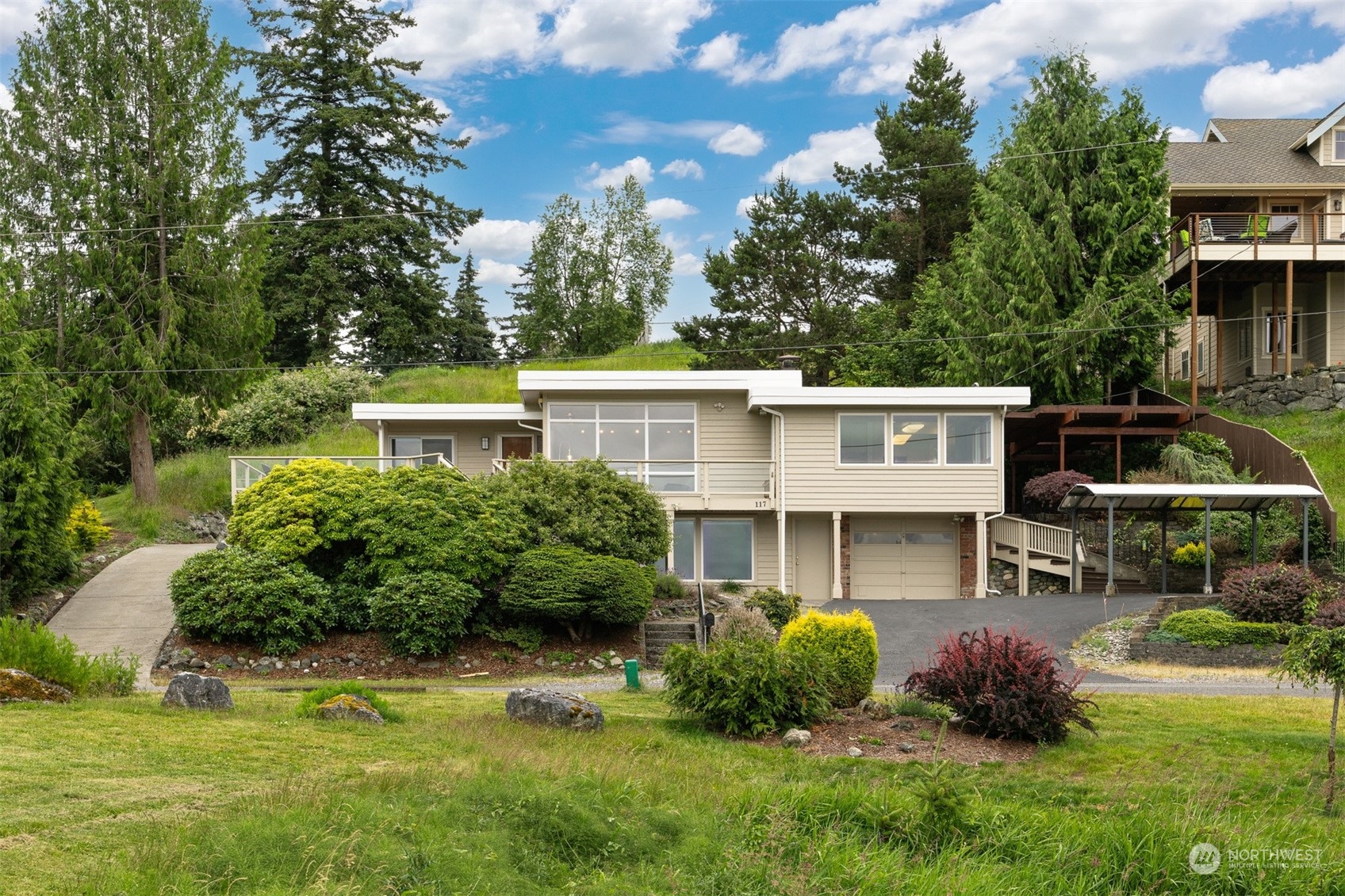 117 Underhill Road Bellingham, WA 98225 - Photo 3 of 40 a front view of a house with a garden