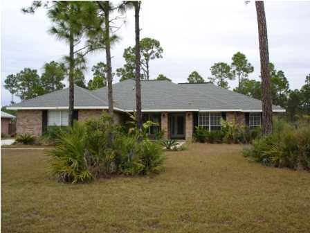112 Shipwreck Road Santa Rosa Beach, FL 32459 - Photo 1 of 23 a front view of a house with a yard