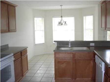 112 Shipwreck Road Santa Rosa Beach, FL 32459 - Photo 11 of 23 a kitchen with a sink a window and cabinets