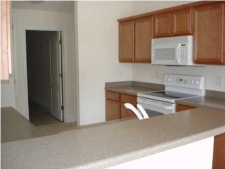 112 Shipwreck Road Santa Rosa Beach, FL 32459 - Photo 12 of 23 a kitchen with a sink and a microwave