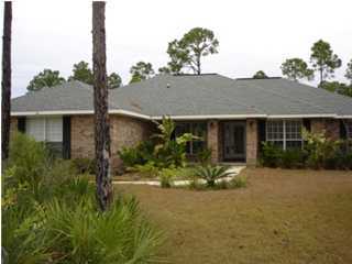 112 Shipwreck Road Santa Rosa Beach, FL 32459 - Photo 2 of 23 a front view of a house with a yard