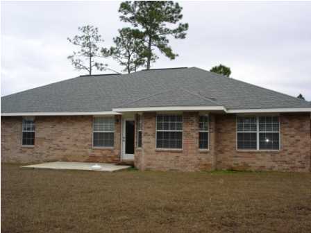 112 Shipwreck Road Santa Rosa Beach, FL 32459 - Photo 4 of 23 a front view of a house with a tree