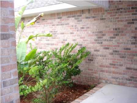 112 Shipwreck Road Santa Rosa Beach, FL 32459 - Photo 6 of 23 a brick building with a small yard