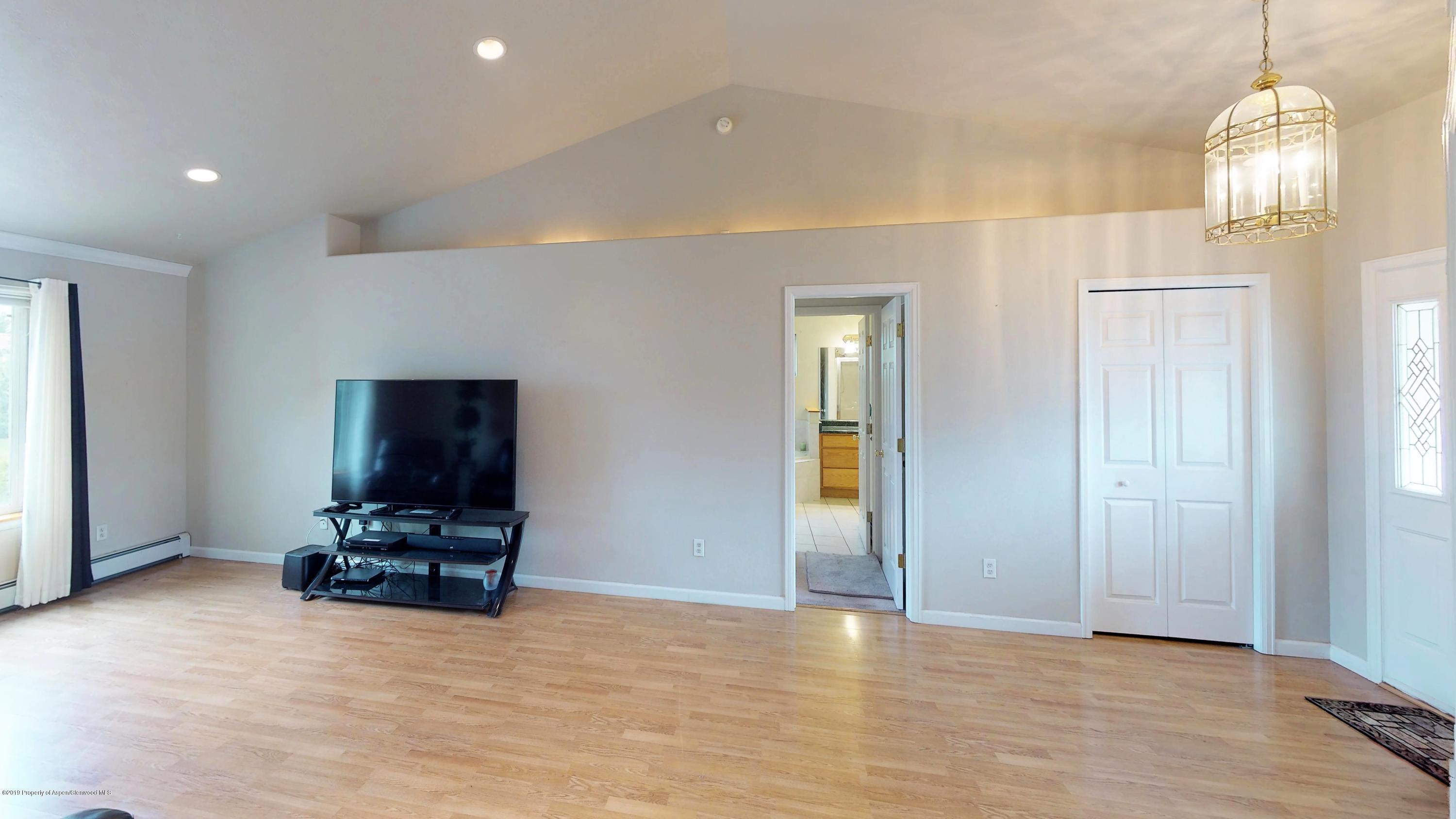 1293 Fir Avenue Rifle, CO 81650 - Photo 14 of 49 a view of a livingroom with furniture and a chandelier