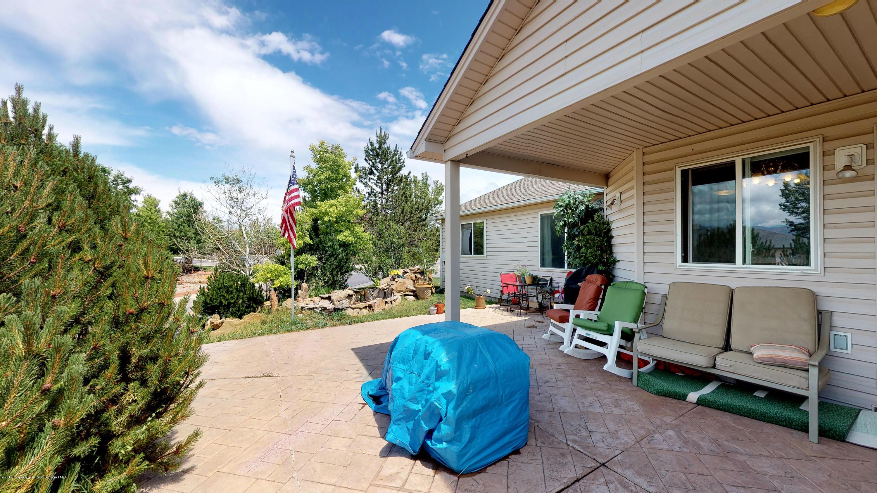 1293 Fir Avenue Rifle, CO 81650 - Photo 47 of 49 a backyard of a house with outdoor seating