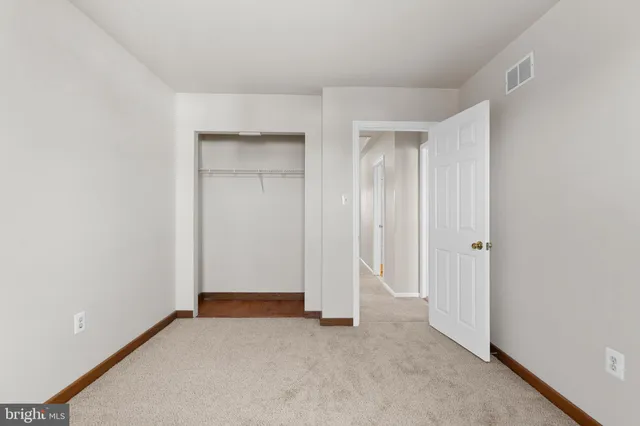 an empty room with closet