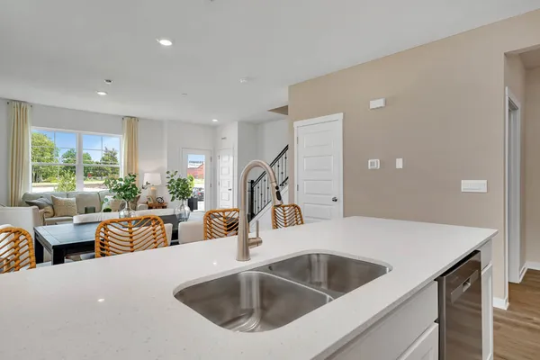 a kitchen with a sink and a refrigerator