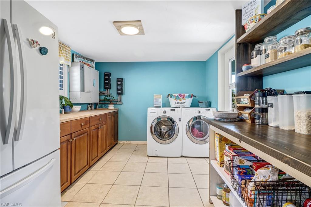 160 4th Street Naples, FL 34113 - Photo 11 of 34 a utility room with dryer and washer