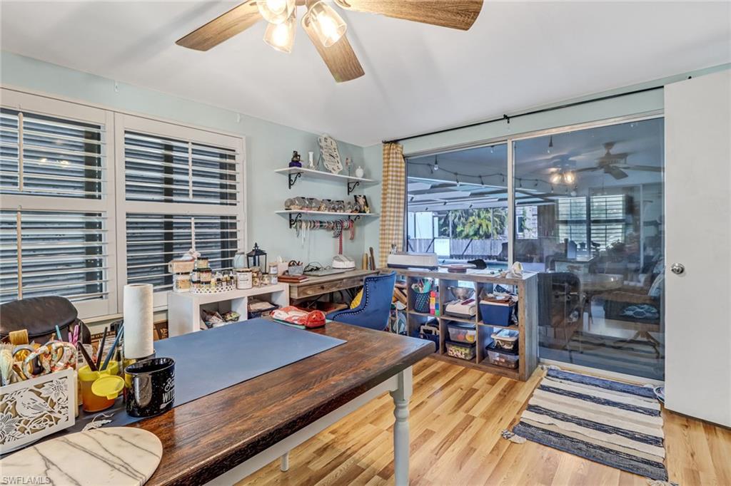 160 4th Street Naples, FL 34113 - Photo 13 of 34 a living room with furniture and a large window