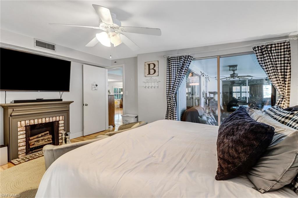 160 4th Street Naples, FL 34113 - Photo 18 of 34 a bedroom with a bed and a flat screen tv