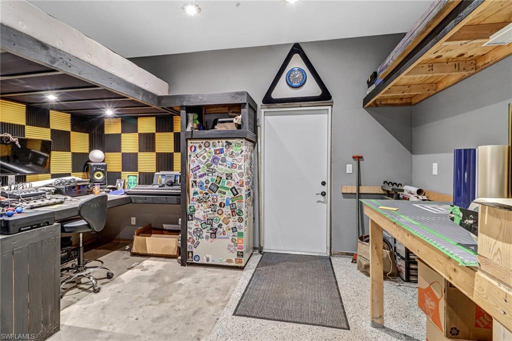 160 4th Street Naples, FL 34113 - Photo 23 of 34 a kitchen that has a lot of cabinets in it