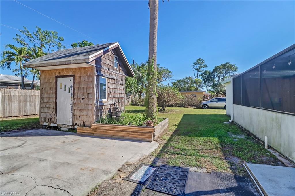 160 4th Street Naples, FL 34113 - Photo 26 of 34 a front view of a house with a yard