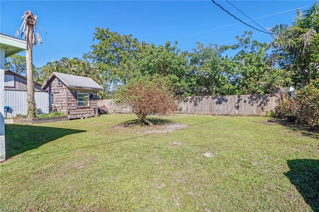 160 4th Street Naples, FL 34113 - Photo 27 of 34 a front view of a house with a yard