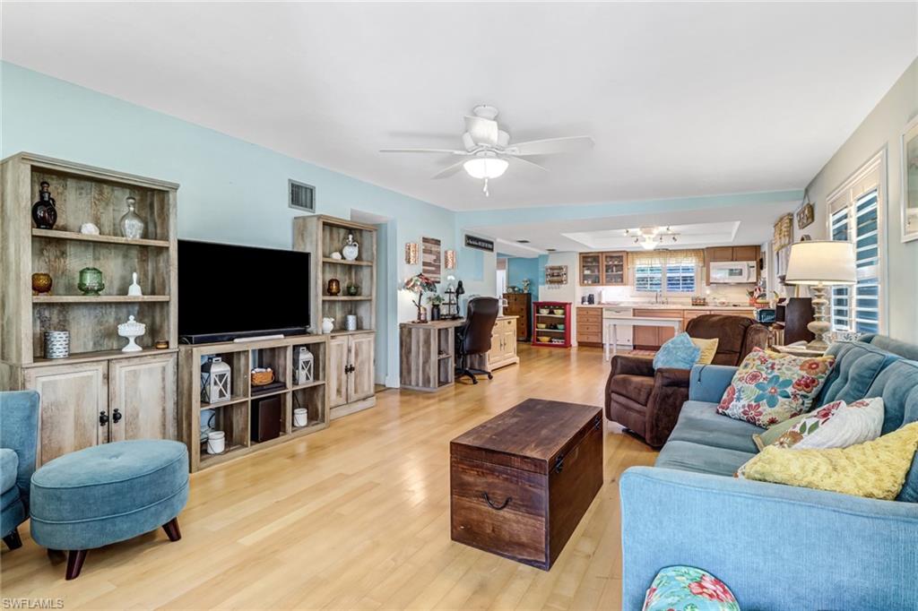 160 4th Street Naples, FL 34113 - Photo 7 of 34 a living room with furniture and a flat screen tv
