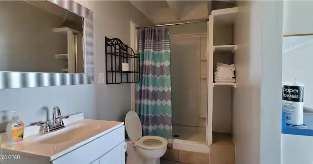 14401 Front Beach Road, Unit 426 Panama City Beach, FL 32413 - Photo 10 of 21 a bathroom with a sink toilet and shower