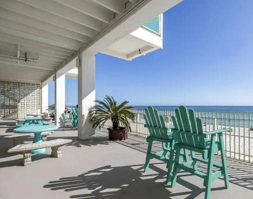 14401 Front Beach Road, Unit 426 Panama City Beach, FL 32413 - Photo 4 of 21 a living room with patio furniture and a floor to ceiling window