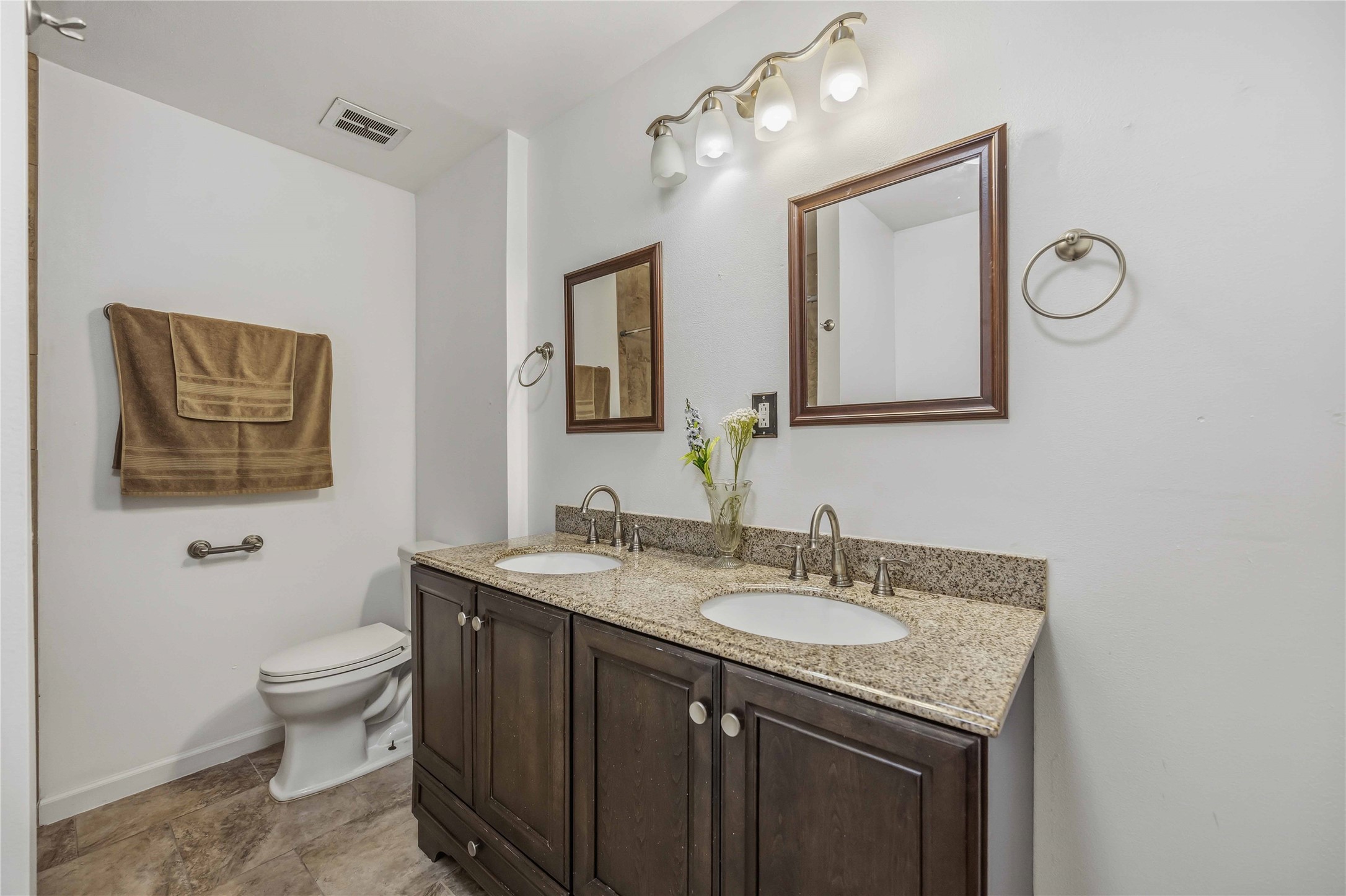 435 Rolling Wood Road Baytown, TX 77520 - Photo 18 of 29 Secondary bathroom with double sinks and shower/tub combo