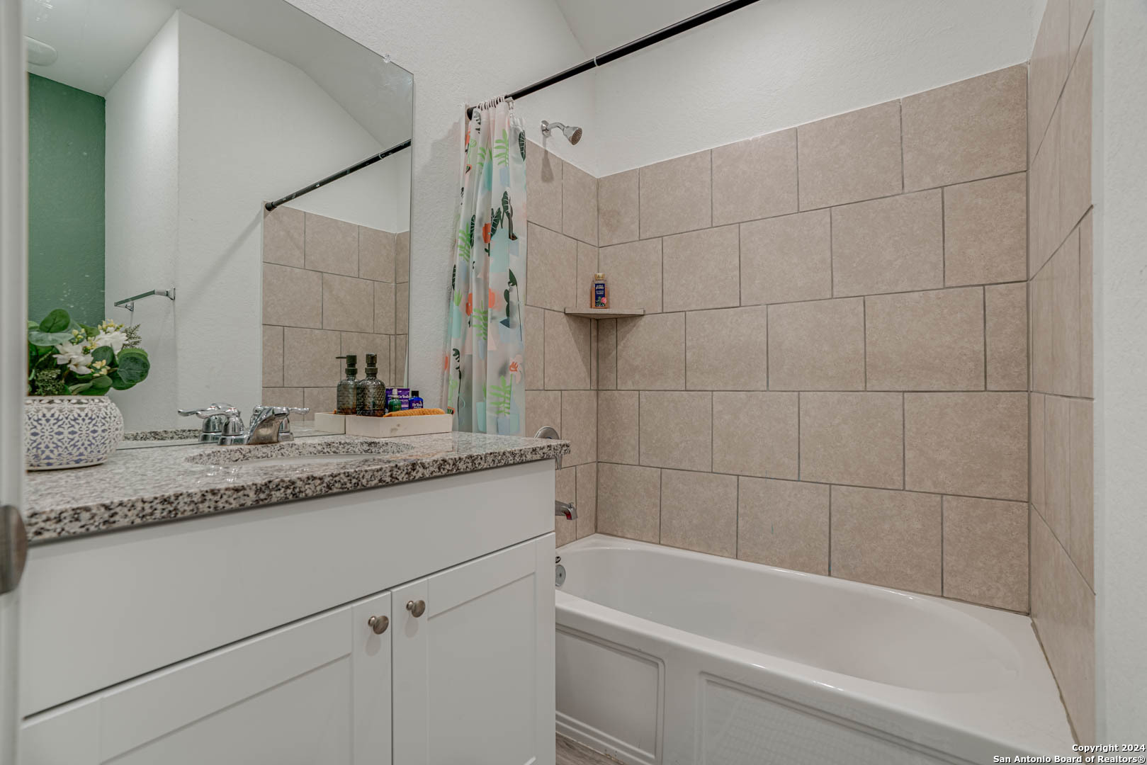 14606 Somerset Mill San Antonio, TX 78254 - Photo 19 of 19 a bathroom with a granite countertop bathtub sink vanity and toilet