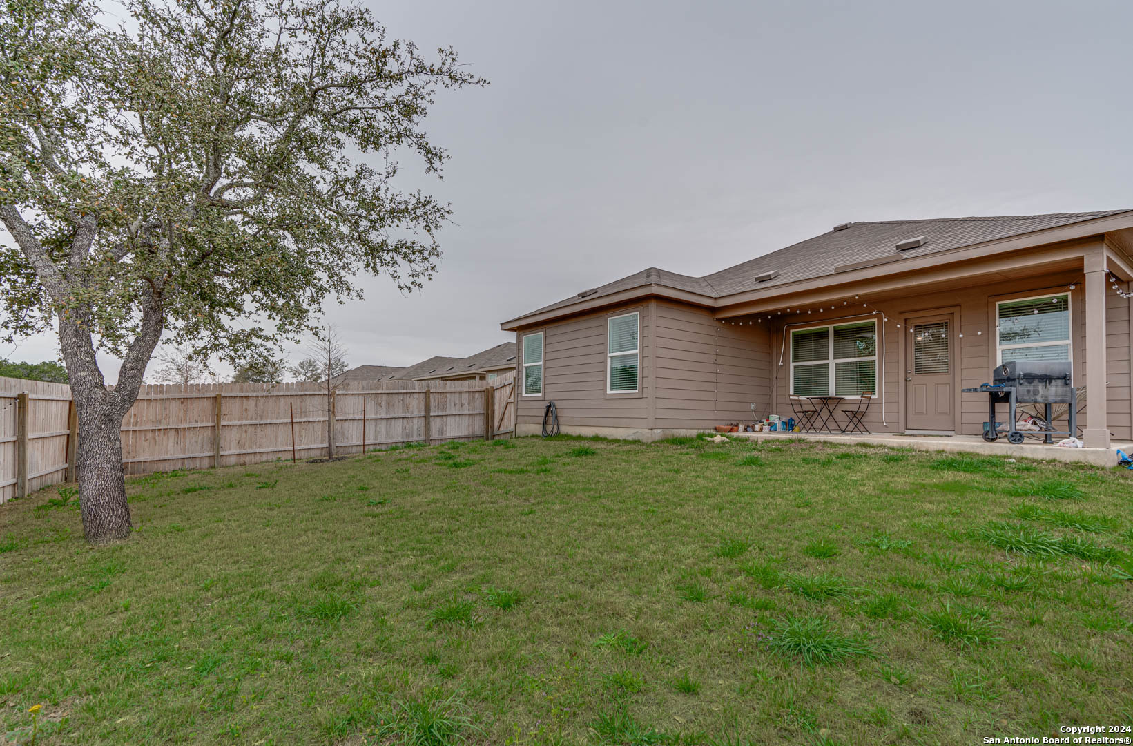 14606 Somerset Mill San Antonio, TX 78254 - Photo 2 of 19 a backyard of a house with lots of green space
