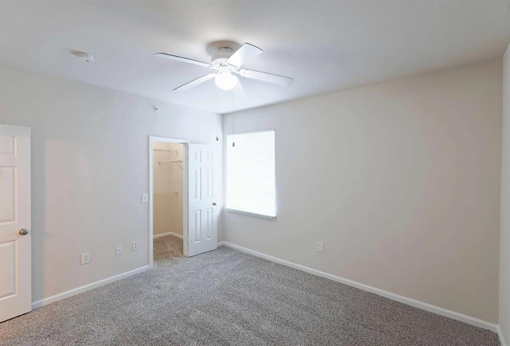 10505 I-35 Frontage Road South, Unit 632 Austin, TX 78747 - Photo 17 of 22 an empty room with windows and fan