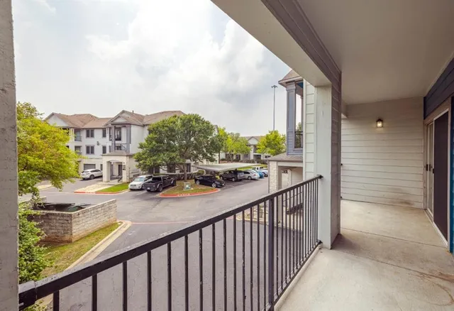 a view of a street from a balcony