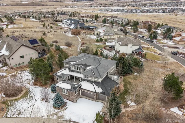 an aerial view of residential house with outdoor space