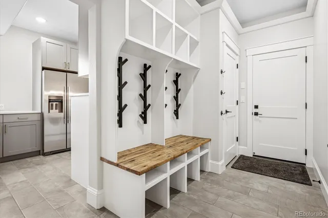 a bathroom with a granite countertop sink a toilet and shower