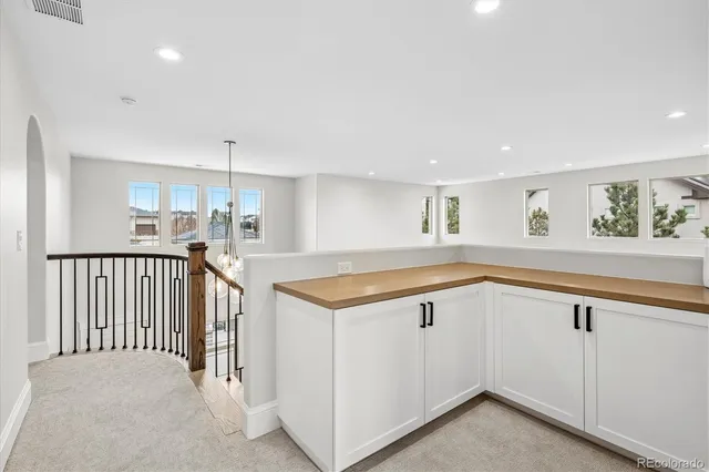 a view of a kitchen with a sink and a window