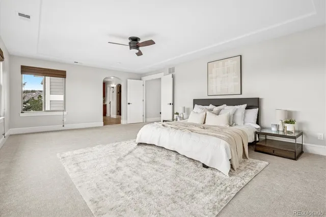 a bedroom with a bed and window