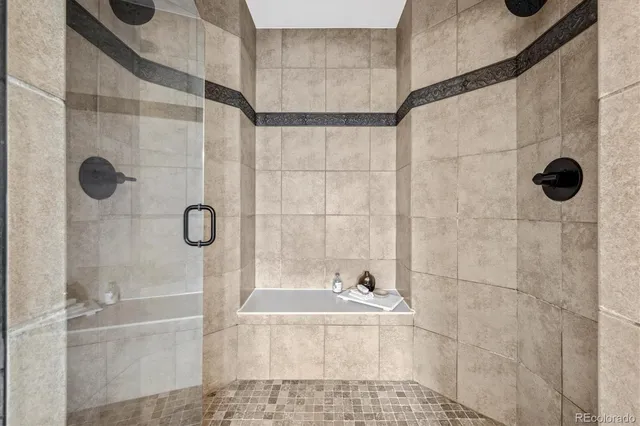 a bathroom with a shower and a sink