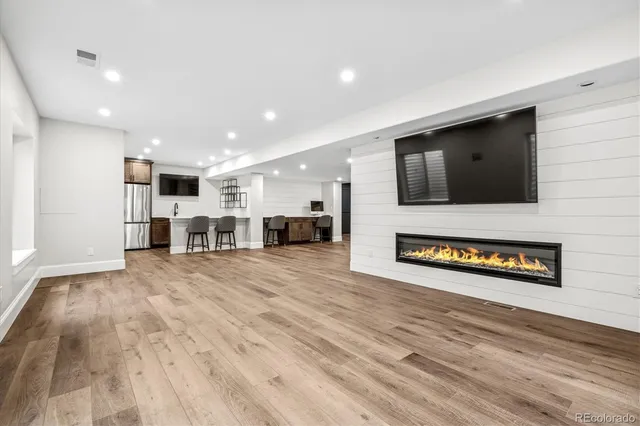 a view of kitchen with furniture and flat screen tv