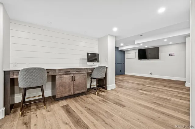 a room with furniture and a flat screen tv